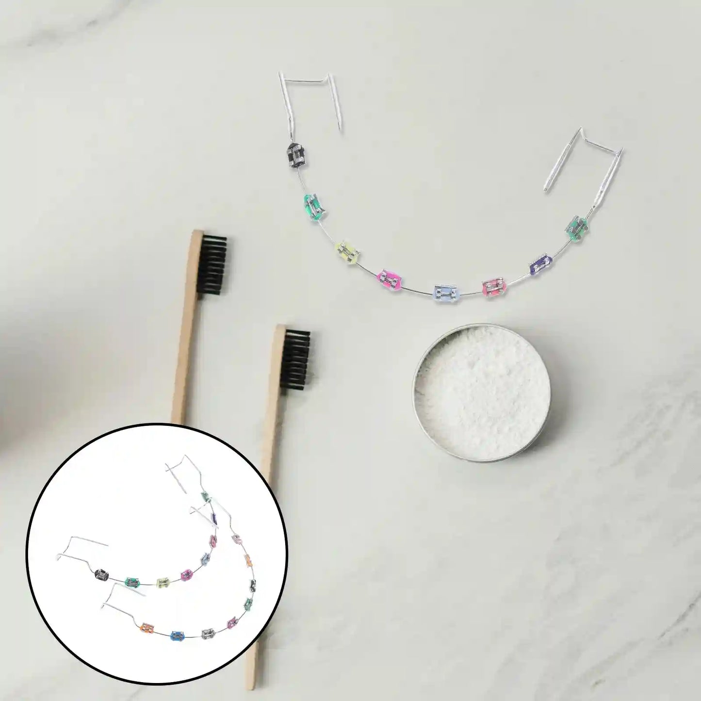 Metal brackets, chain ties, and arch wire applied to teeth correction model for training.