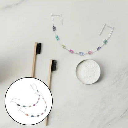 Metal brackets, chain ties, and arch wire applied to teeth correction model for training.