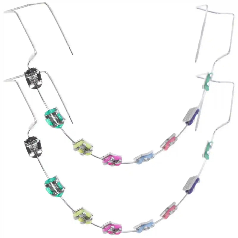 Metal brackets, chain ties, and arch wire applied to teeth correction model for training.