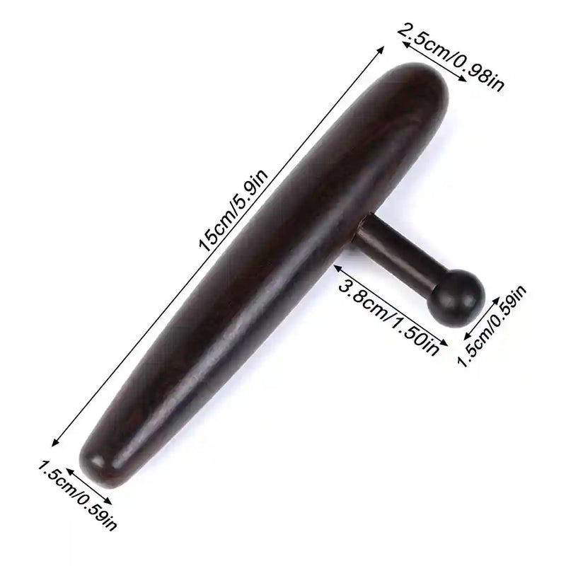 Professional massage therapist using the deep tissue tool to relieve tension in a client’s back.